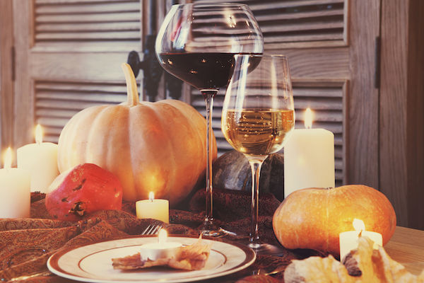 Thanksgiving Table Setting with Wine and Pumpkins