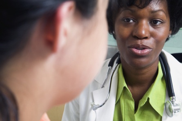Close up of female doctor talking to patient
