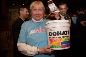 Woman collecting donations at Capital Pride Reveal