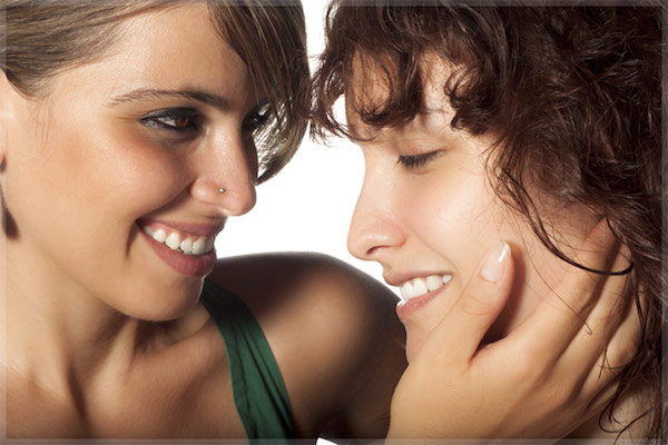 two women smiling together