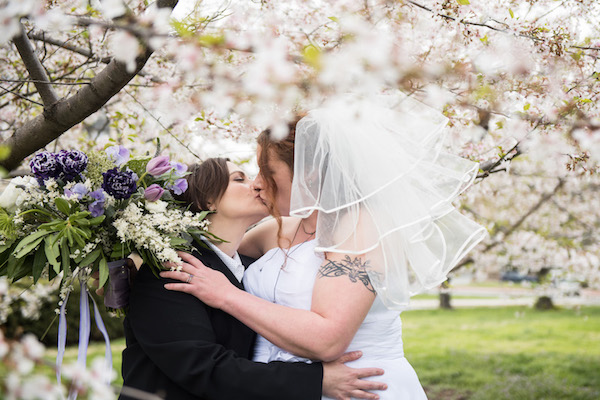 Jonna and Kimberly kissing at their wedding