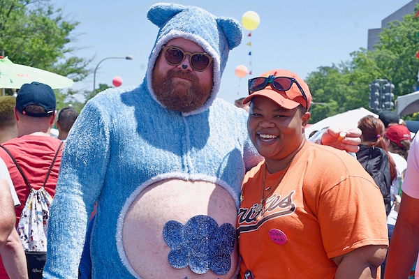 Man in bear suit and woman at pride festival