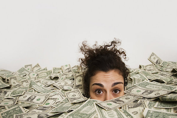 Woman in a pile of money