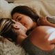 Two women carefree in bed
