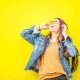 Cheerful bold woman with yellow background