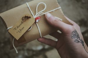 Someone holding Brown greeting card