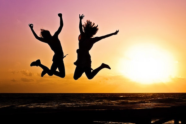 Two women jumping