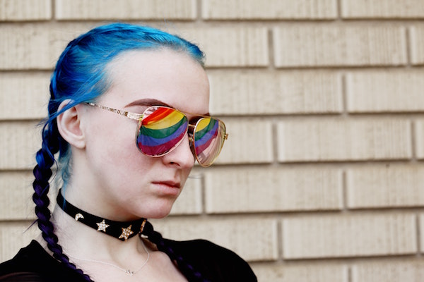 Woman with rainbow sunglasses