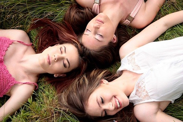 Three women laying down