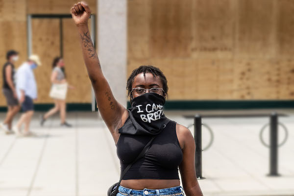 Black woman holding up fist