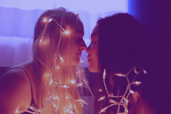 Lesbian couple w/ christmas lights