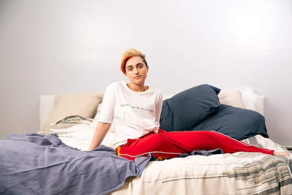 a transmasc person in bed