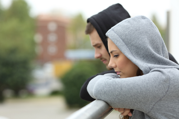 woman and man in hoodies