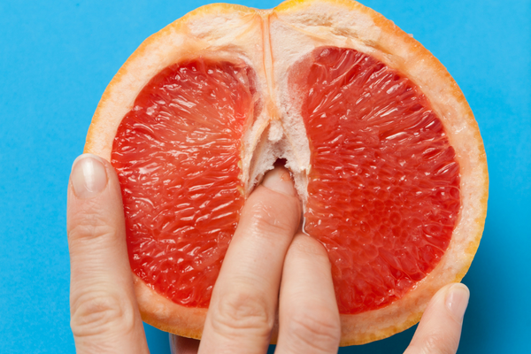 fingers in grapefruit