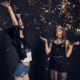 two women with confetti