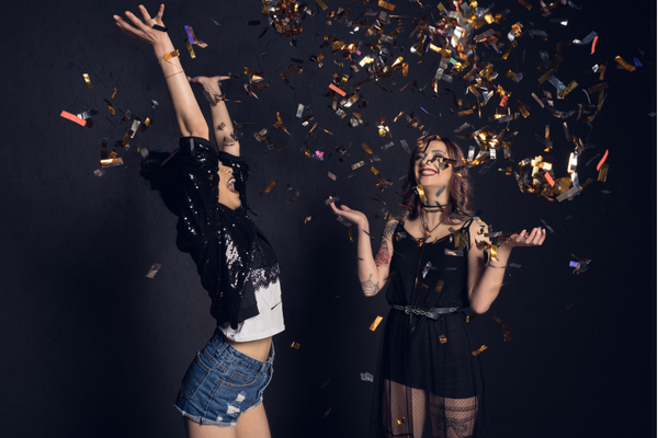 two women with confetti