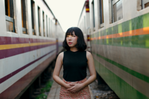 asian woman between trains