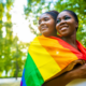 two black women with rainbow flag