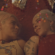 Karol G & Young Miko in "Contigo" music video