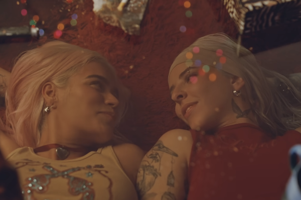 Karol G & Young Miko in "Contigo" music video