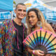 Two members of the LGBTQ+ community pose together at a Pride event in South Florida.