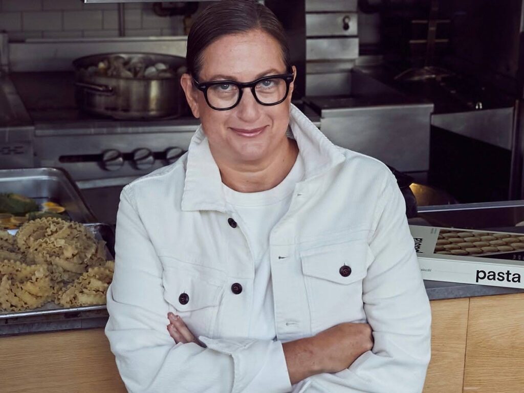 Chef Missy Robbins poses in a white chef's coat.