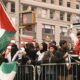 A group of people in New York City rally in support of Palestine.