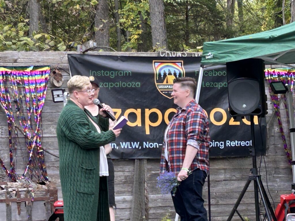 Campers Olivia D. and Caitlin S. read their vows in their surprise Lezapalooza wedding.