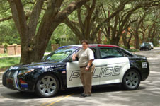 Sandy Rogers with police car