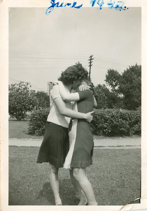 Two women kissing and embracing
