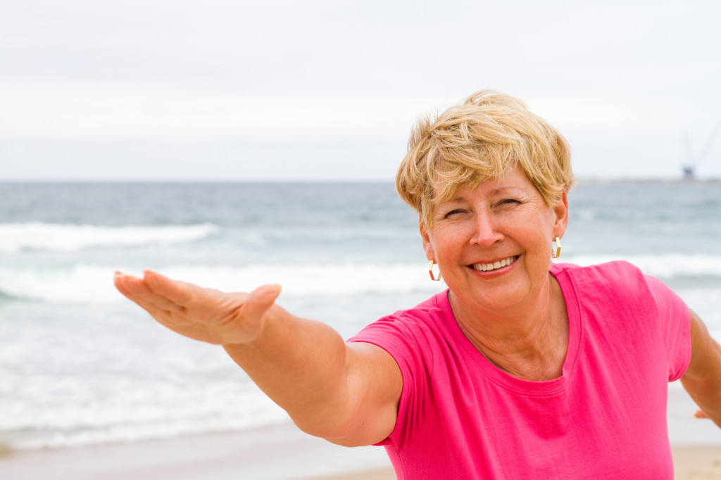 senior woman workout on beach