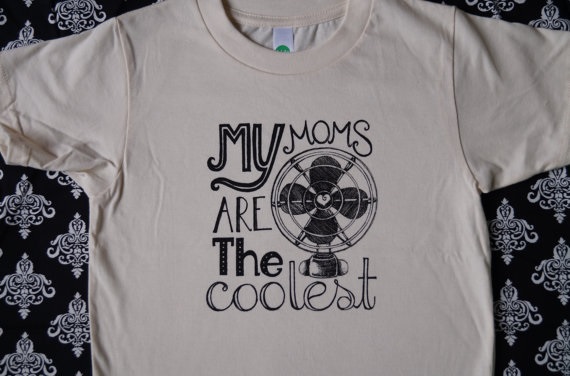 A gray t-shirt that says "My moms are the coolest" next to an illustration of a fan. 