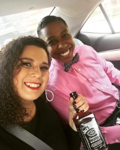 Jade (left) and Eboné (right) in Uber with Jack Daniels bottle