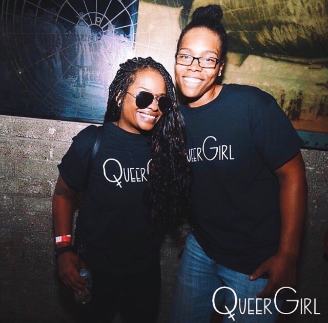 Ladies posing, with QueerGirl shirts